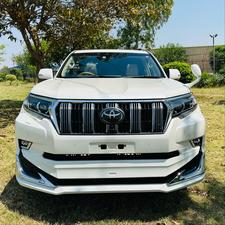 Toyota LandCruiser Prado TX  limited 2700cc (eco pro)
Model 2019/11 import  from japan April 2024 
Pearl white with beige leather interior 
Mileage  38000 km
Auction grade 4.5 A ( spotless condition)
7 seater  leather with sunroof 
Parktronic sensors & adopted Radar 
B&O sound system with 360 degrees cameras  front & rear 
Ambient lights
Wooden steering wheel  & full wooden interior 
Remote control smart starring & climate control access.
LED Xinon headlights with electric washers
Full body kit modilista & sport side skirts foot panels.
Crome package 
Full sports body kit available in the suv .
Further information please contact 11am to 10 pm & physically visit at Victory Cars jail road Lahore.