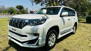 Toyota LandCruiser Prado TX  limited 2700cc (eco pro)
Model 2019/11 import  from japan April 2024 
Pearl white with beige leather interior 
Mileage  38000 km
Auction grade 4.5 A ( spotless condition)
7 seater  leather with sunroof 
Parktronic sensors & adopted Radar 
B&O sound system with 360 degrees cameras  front & rear 
Ambient lights
Wooden steering wheel  & full wooden interior 
Remote control smart starring & climate control access.
LED Xinon headlights with electric washers
Full body kit modilista & sport side skirts foot panels.
Crome package 
Full sports body kit available in the suv .
Further information please contact 11am to 10 pm & physically visit at Victory Cars jail road Lahore.