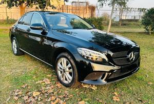 Mercedes-Benz C180 avantgrade-S  package ( twin turbo charged)
Model 2019 ( original facelift)
Registered Islamabad 2020
Shahnawaz import 
Mileage 13000
Brand New condition ( bumper to bumper original & spotless)
Full service history in shahnawaz Lahore. Only one moter oil changed.
Colour Black with beige nappa leather interior.
Top of line specs.
Electric Panoramic sunroof 
Premium entertainment sound system 
Electric power seats 
8 zone climate control air conditioning 
54 colours ambient interior lighting 
Adapted cruise control 
360 degrees cameras
Auto Parktronic access 
Multi drivetonic sensors
Multiple driving selection 
LED adapter headlights 
Apple CarPlay & android apps 
Crome line  packages 
18” alloy wheels 
Privacy glass 
Further information please call & visit Victory Cars jail road Lahore.
National wide delivery available.