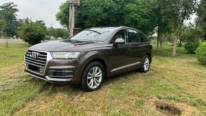 Audi Q7  Quattro. 3.0 V6 supercharged intercooler.360 Bhp
Exclusive premium plus business package 
Audi Pakistan import 
Model 2018 registered 2018 Karachi 
First owner driver, Audi services mentioned & full service history.
Mileage 54000
Pearl brown metallic colour & beige arocco nappa leather interior 
Top of the line specs.
Bumper to bumper original condition & spotless 
Seven seater all seats are electric multi power 
Panoramic sunroof 
Soft closer electric doors
Front seat air conditioning & heated 
12 zone duel climate control air conditioning system 
Bose entertainment sorround sound system with 29 speakers 
Airmatic suspension with Hight control 
360 degrees multi cameras 
Electric telescopic steering wheel 
Adapted cruise control 
Active adapted laser led headlamps 
Multi control Ambient interior light 
Power boot
Wireless charger 
9 tronic multi electric transmission 
Multi windows privacy curtains
19 “ alloy wheels with new tyres 
And lot of options installed.
Further i