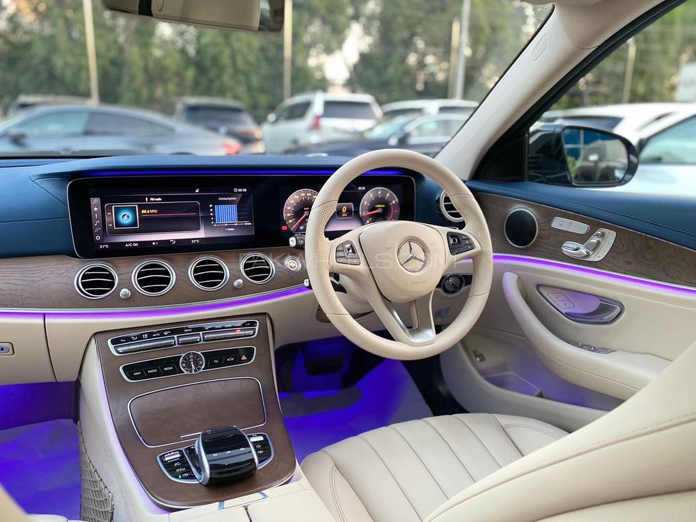 Mercedes E200 Exclusive 
Model: 2018
Mileage: 5,500 Km
Reg: 2018 Khi

*Blue dashboard  
*Panoramic glass sunroof
*Ambient lighting 
*Digital instrument cluster
*Customised steering wheel on order from Shahnawaz 
*Shahnawaz import and maintained

Calling and Visiting Hours. 

Monday to Saturday

11:00 AM to 7:00 PM