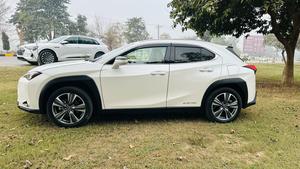 Lexus UX300e ( EV ) ultra luxury plus takumi package 
Model 2021/11 production fresh import 2024 from Japan.
Brand new vehicle ( spotless condition )
Pearl diamond metallic white with brono nappa leather interior.
Mileage 3000 km
Auction grade: 5AA
Battery range 375 km
Top of the Line specs.
All wheel drive ( AWD )
All seat heated & ventilated air conditioned 
Heated steering wheel 
Electric telescope steering wheel 
Memory & multi power electric seats 
Head up display 
Blind spot monitor ( BSM )
Lane  assistance 
3 mode driving modes
Lambs support 
Voice activation assistance 
Glass electric Sunroof 
Wireless charger 
Mark luvinson surround sound entertainment system with 15 speakers 
Privacy glass 
Power boot
Google maps & Apple CarPlay 
Adapted cruise control 
Adapted Radar
Airmatic electric sports suspension 
Parktronic sensors all sides
Auto pilot 
7 cameras 360 degrees 
18 “ Lexus note black Crome L sport alloy wheels.
Adapted auto laser active led headlamps 
11 kw charger