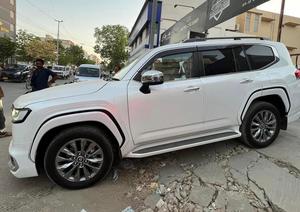 LandCruiser ZX lc300 , model 2023 fresh import 2025 February, top of the line specs.
Aution grade 6AA, JBL cool box full body kit & rear entertainment 
Further information please contact & visit at Victory Cars jail road Lahore