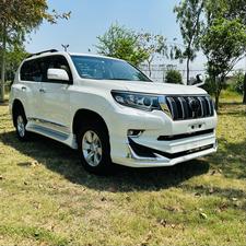 Toyota LandCruiser Prado 2700cc txl 
Model 2019 fresh import 2024 
Un-registered 
Pearl white metallic with beige leather interior 
Bumper to Bumper original condition ( spotless) 
7 seater with sunroof 
Multi power nappa leather electric seats 
Heated & cooling ( ventilated ) seats 
Cool box 
Multi zone duel climate control system 
B&o entertainment sound system
Multi cameras 
Adapted Radar 
Active line accessed 
Adapted cruise control 
Auto parking accessible 
All zone parktronic sensors 
Full  glossy wooden interior 
Full trd sport body kit 
Crome package 
Further information please contact & visit Victory Cars jail road Lahore