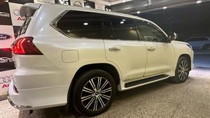 Lexus LX570 (ultra sports utility package)
Model 2019 fresh import 2025
Unregistered 
Diamond White metallic with orinzo bronze nappa leather interior 
Brand new condition ( spotless )
Mileage 22000 km 
Auction grade 5 AA
Top of the line specs ( full house )
Original body kitted 
Further information please call & visit at Victory Cars jail road Lahore.