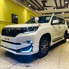 Toyota LandCruiser Prado TX-L 
Mode 2019 fresh import ( unregistered)
Mileage 33000 km
Pearl white with beige leather interior 
Brand new condition ( spotless)
Auction grade 4.5
7 seater with sunroof 
Top of line specs.
Nappa leather multi power seats with heated & ventilated ( air conditioning)
B/o premium entertainment sound system.
Multi cameras 
Customised fitting 
Crome package 
8 zone climate control air conditioning system 
Adapted active Radar 
Line accessed 
Adapted cruise control system 
All zone parktronic sensors 
Full body kit
18” alloy wheels with new tyres.
Further information please call & visit at Victory Cars jail road Lahore.