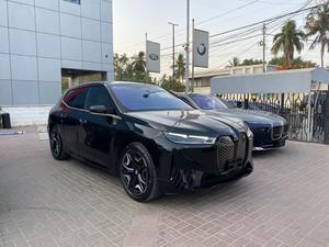 BMW iX Xdrive 50
Model: 2023
Mileage: 3,800 km
Un-Registered 
Japan Import

One & Only with 
530 Hp & 550 km Range

Black sapphire Metallic Colour 
with Tan Interior

*Wireless Apple carplay and android auto
*LED headlights 
*Ambient lights
*Four-zone climate control
*Comfort Access keyless entry 
*Bowers and wilkins sound System
*14.9-inch touchscreen infotainment system
*Active steering
*Soft closing doors
*BMW Natural Interaction voice assistant
*22-inch alloy wheels
*Front massage seats
*Panoramic glass roof sky lounge with electrochromatic shade function

Calling and Visiting Hours

Monday to Saturday

11:00 AM to 7:00 PM
