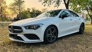 Mercedes-Benz CLA 200 sport back coupe sedan , ultimate AMG sport package 
1.6 cc twin turbocharged with 10 speed triptonic transmission.
Model 2021 registered Punjab 2022
Shahnawaz Pakistan import 
Mileage 18500 km
First owner vehicle 
Diamond white metallic colour with black two tone Dezine line AMG interior.
Bumper to bumper original condition & spotless.
Top of the line specs & customised options.
Glass panoramic electric sunroof 
Two tone leather AMG bucket seats
Multi power & 11 zone adjustment seat 
Heated & ventilated seats
8 zone climate control air conditioning 
Full dashboard single line  led cluster display.
64 colours ambient interior lighting 
Burdmaster pro premium surround sound system 
Multi 360 degree cameras 
Auto pilot 
Apple CarPlay & android apps
Electric multi zone massager seats 
Perfume air package 
Adapted Radar 
Adapted cruise control 
Line assisted & blind spot monitor 
Privacy glasses package 
All zone parktronic sensors access 
AMG suspension & break
Full AMG body kit
19” AMG alloy wheels 
Duel AMG mufflers
Further information please call & visit at Victory Cars Lahore.