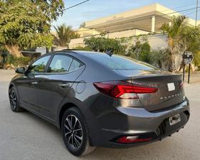 HYUNDAI ELANTRA GLS TOP OF THE LINE NEW RIMS (2000cc)
Model 2021 December || Registered 2022
Only 25,300 KM 100% Genuine 
Hyundai South Maintained 
Cyber Grey Color 
Bumper to bumper original guaranteed 100 %
TOP OF THE LINE
Original NEW TV Back Cam
Original NEW Leather Seats
Original NEW RIMS
Sunroof 
Wireless Charger
Dual Power Seats
Spare Wheel Unused 
Fog lights
Just Like Zero Meter 
All seals still intact 
See to Believe 
Ready Delivery 
EXCHANGE POSSIBLE WITH ANY CAR

For inspection
Available at SUPREME CARS
Plot # 151/F,Under Imam heights,Shop no.1&2, Main Khalid Bin Walid Rd, Karachi, Sindh 75400

|  Premium Cars  |  Best Prices  |  Optimum Performance | 
#supremecarsgang