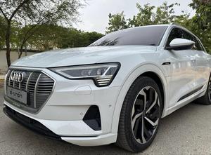 AUDI ETRON 50 QUATTRO TOP OF THE LINE (230KW)
Model 2022 || Registration 2022 
Choice Registered *800*
10,000 miles Driven 
Audi Maintained 
White Color
Bruno Interior
Bumper to Bumper Original Paint 100%
Scratch-less & Spotless
FULL HOUSE 
Just as good as Brand New   
Original TV 
Original Rims 
Still Smells like zero meter 
SEE TO BELIEVE 
READY DELIVERY 
EXCHANGE POSSIBLE WITH ANY CAR

For inspection
Available at SUPREME CARS
Plot # 151/F,Under Imam heights,Shop no.1&2, Main Khalid Bin Walid Rd, Karachi, Sindh 75400

|  Premium Cars |  Best Prices |  Optimum Performance | 
#supremecarsgang