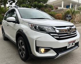 HONDA BRV S PACKAGE TOP OF THE LINE NEW SHAPE PUSH START LIMITED EDITION(1500cc)
Model 2020 || Registered 2020
Only Genuine 28,000 KM
Taffeta White Color
Bumper to Bumper Original 100%
Guaranteed 
Scratch-less Spotless  
Push start
Centre console/ Hand-rest
Automatic Transmission
Original TV NAV
Climate Control
New Grill 
Original Fog Lights
Genuine Rims
Just like Zero Meter
All Seals Still Intact 
EXCHANGE POSSIBLE WITH ANY CAR

For inspection
Available at SUPREME CARS
Plot # 151/F,Under Imam heights,Shop no.1&2, Main Khalid Bin Walid Rd, Karachi, Sindh 75400

|  Premium Cars  |  Best Prices  |  Optimum Performance | 
#supremecarsgang