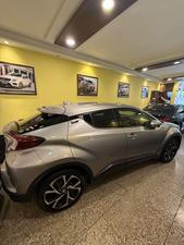 Toyota CH-R  1800cc hybrid 
G-led package 
Model 2019 fresh import 
Mileage 56000 km
Verified Auction sheet 
Pearl Bronze metallic colour with brown leather interior .
Bumper to Bumper original condition ( spotless)
Top of the line package 
Multi cameras 
Apple CarPlay, Bluetooth & android app. With 11 speakers 
Adapted Radar 
Blind spot monitor 
Line accessed 
Adapted cruise control 
19” alloy wheels 
Future information please call & visit Victory Cars jail road Lahore.