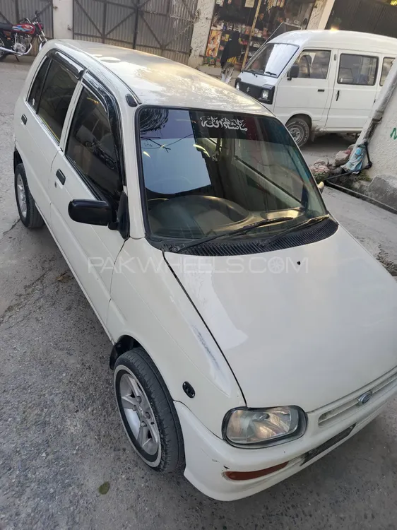 Daihatsu Cuore 2004 for Sale in Abbottabad Daihatsu Cuore 2004 for Sale in Abbottabad Image-9
