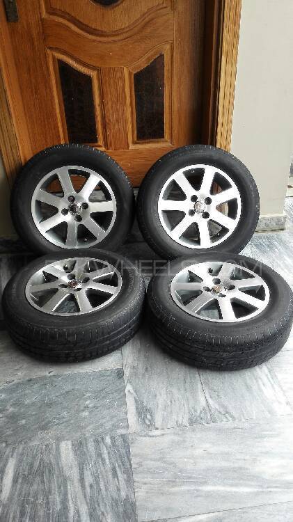 4 Bridgestone tyres with alloy rims Image-1