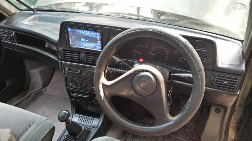 Daewoo Racer and other car's dashboard  Image-1