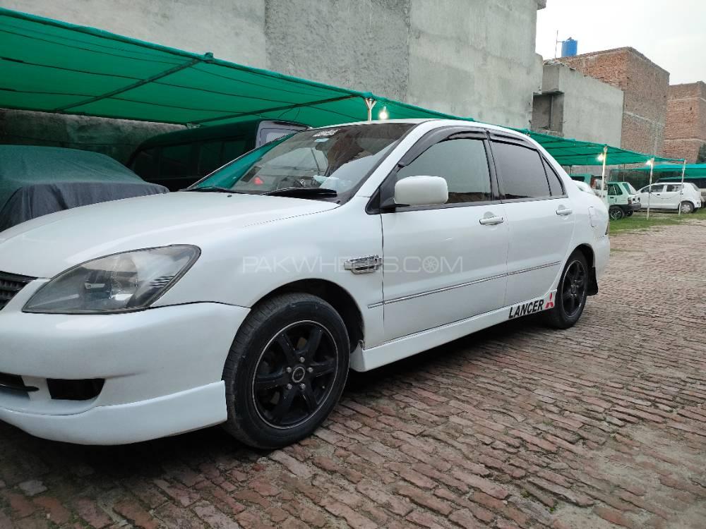 مٹسوبیشی لینسر - 2004  مٹسوبیشی لینسر - 2004  Image-1