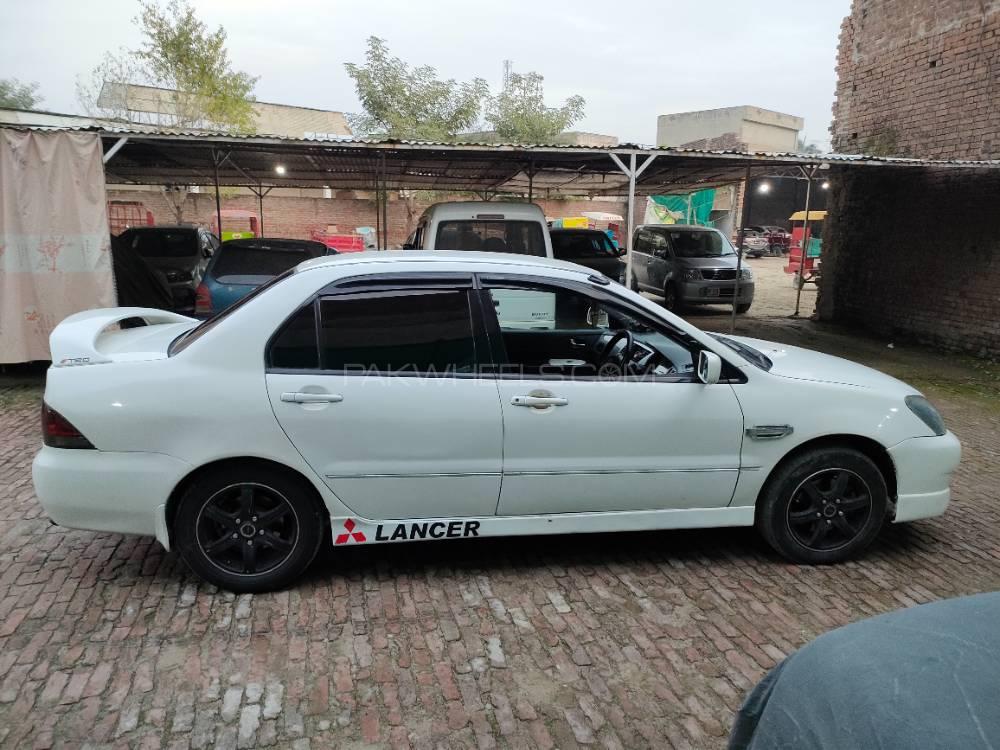 مٹسوبیشی لینسر - 2004  مٹسوبیشی لینسر - 2004  Image-2