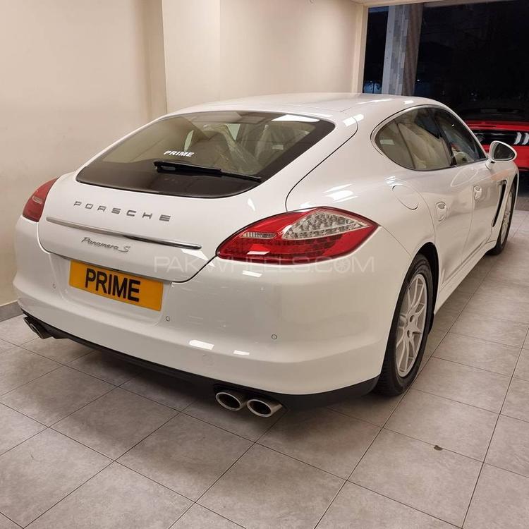 Porsche Panamera S Hybrid
3000cc V6 Engine
Model 2013
Registered 2013
16000 Km
White
Luxor Beige Interior
Yachting Mahogany Interior Package
Yachting Mahogany Heated Multifunction Stearing Wheel
Sport Chrono Package
Soft Closing Doors
Porsche Crest Embossed on Headrest
Sunroof
BOSE Sound System
Rear Automatic Blinds
Height Control
Adjustable Suspension
Single Owner
Spare Key


Location: 

Prime Motors
Allama Iqbal Road, 
Block 2, P..E.C.H.S,
Karachi